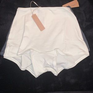 “bone” color SKIMS shorts